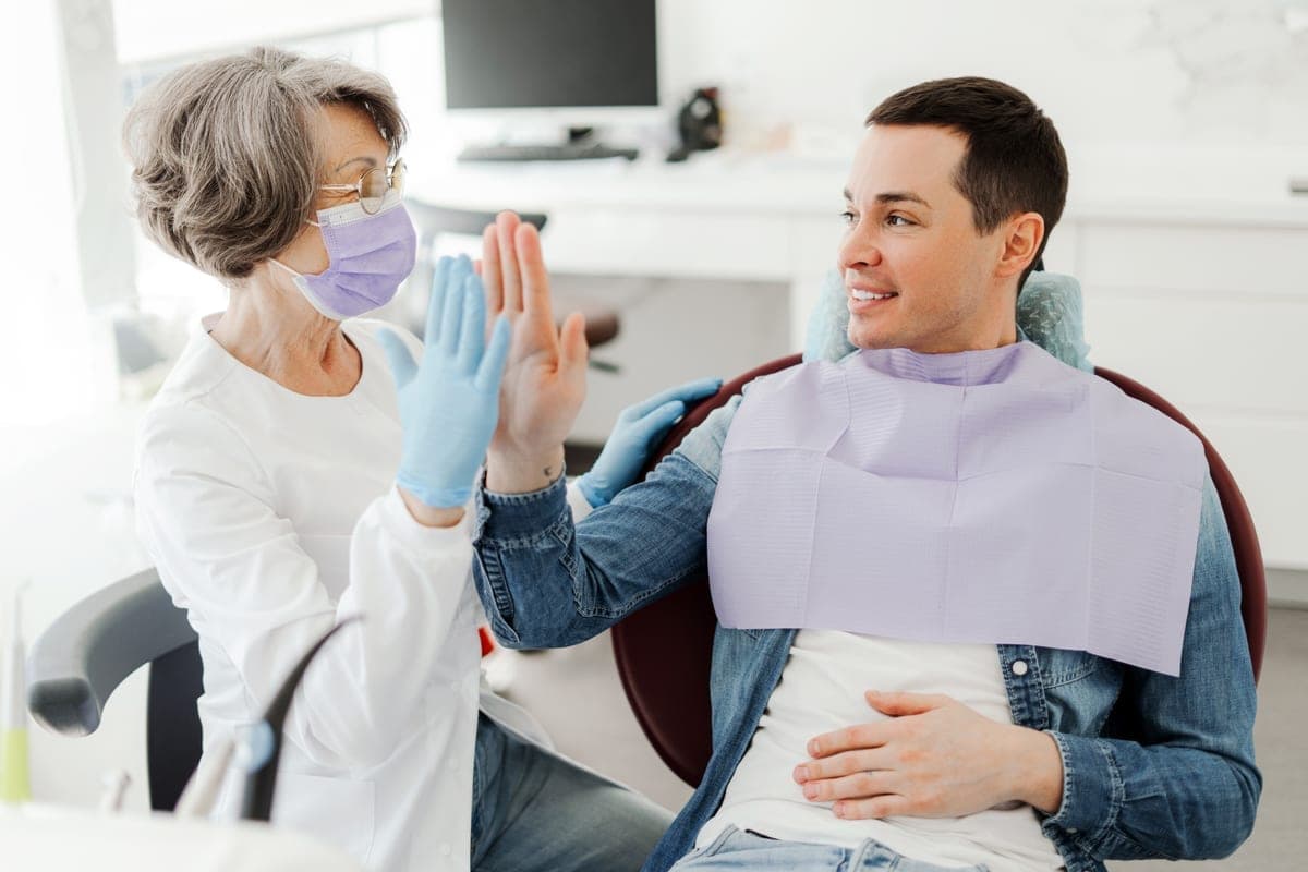 Dental cleanings and exams in Clearwater: hygienist performing a professional cleaning