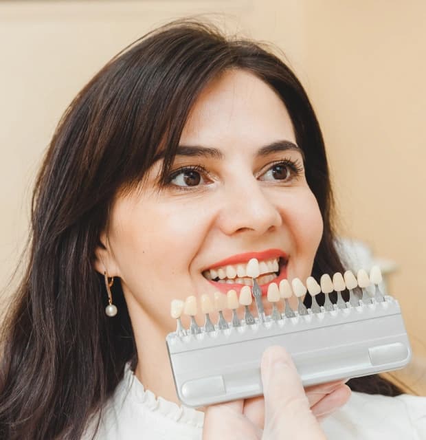 Confident patient smiling with porcelain veneers in Clearwater, FL