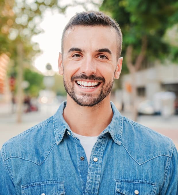 Patient smiling after treatment with a restorative dentist in Clearwater, FL