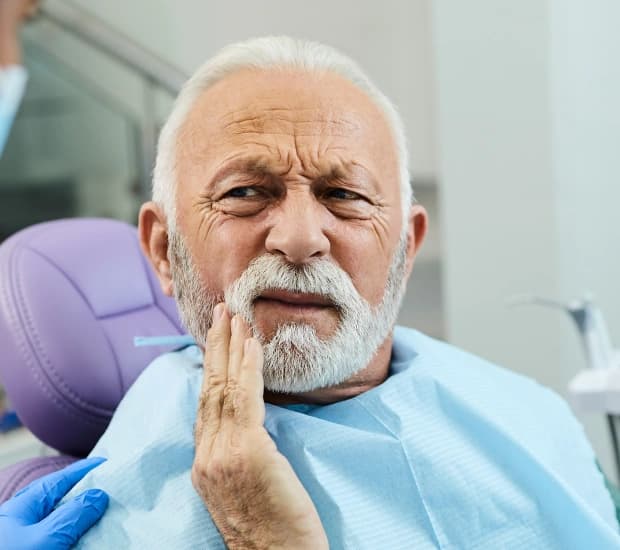 Dentist explaining tooth extractions in Clearwater, FL to a patient